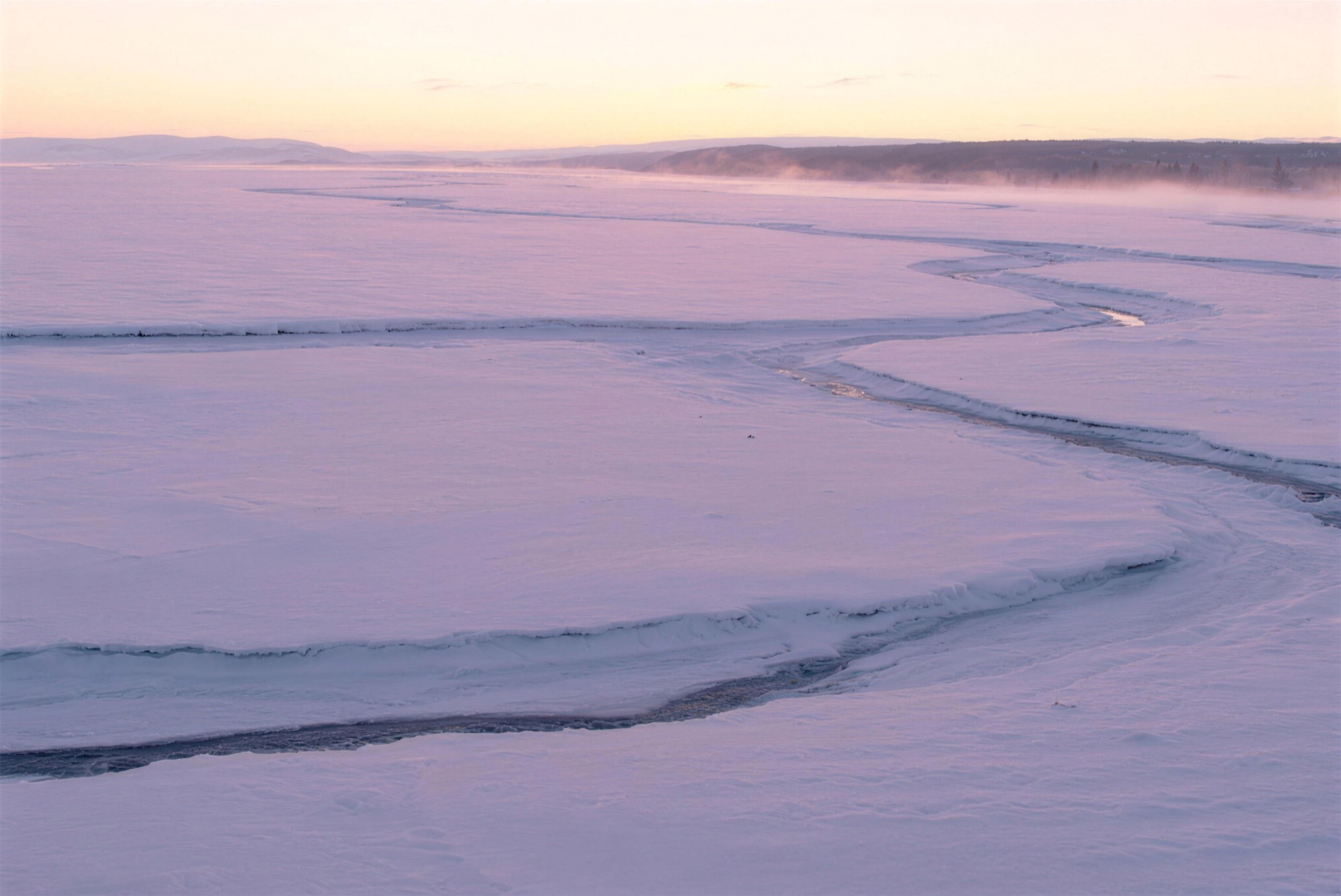 A frozen river in soft morning light