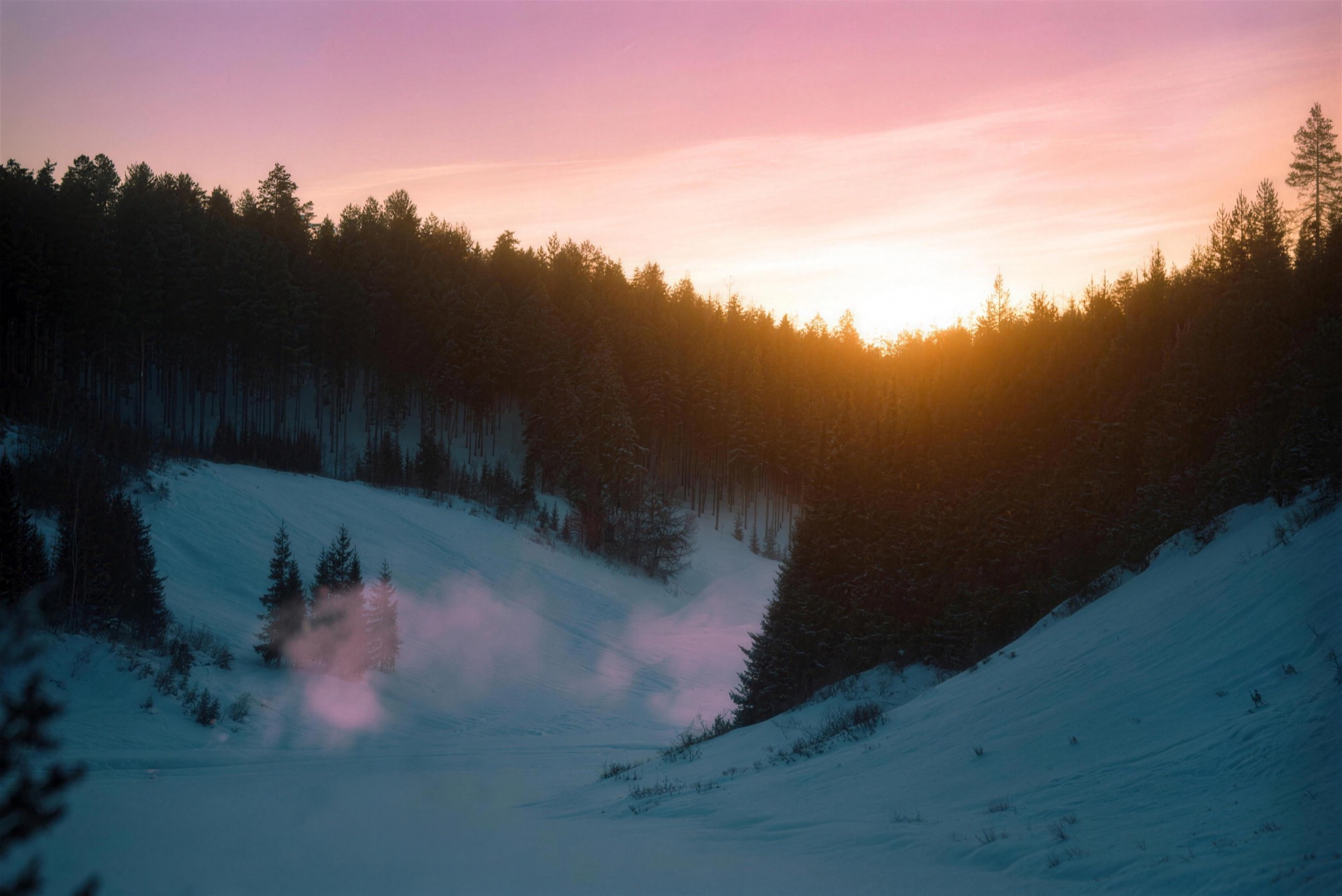 Winter sunrise over forest and river